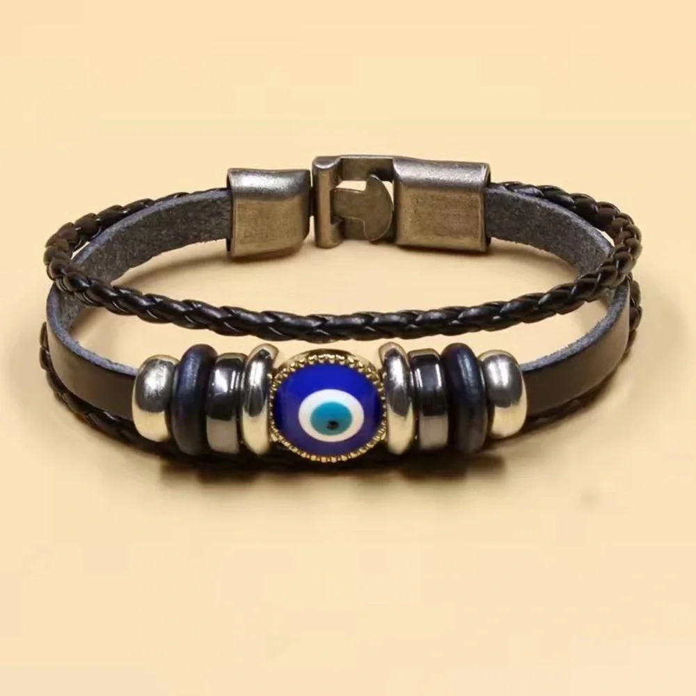 NWOT. UNISEX .Black and Blue Wristband with Eye Design
